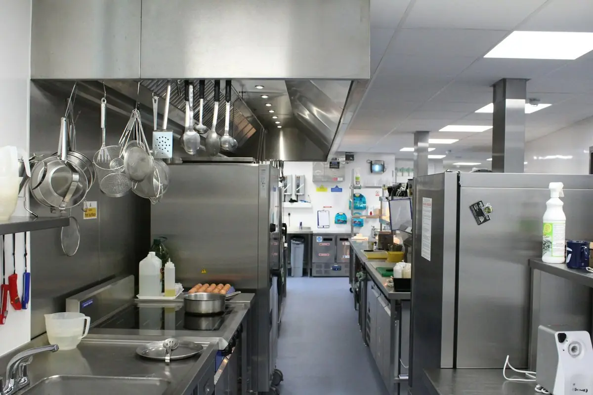 Commercial kitchen with stainless steel equipment